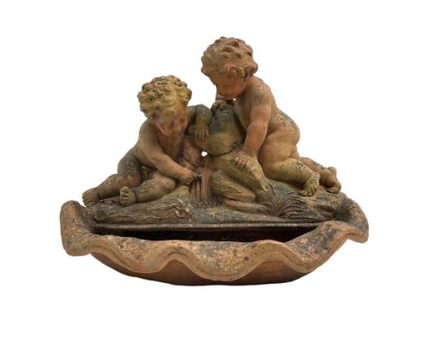 Terracotta garden fountain in the form of putti on a naturalist base, raised upon shell basinDimensions: Height:&nbsp;52cm&nb