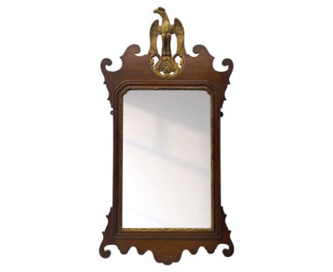 Chippendale design mahogany framed wall mirror, the gilt carved pediment in the form of an eagle, rectangular bevelled plate 