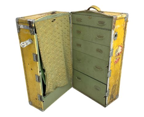 Early 20th century steamer traveling trunk, in yellow finish with chrome fixtures, the interior fitted with drawers and hange