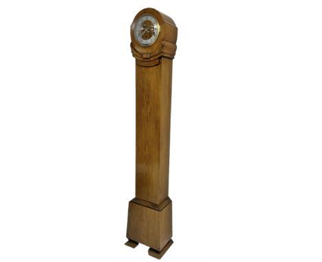 English - 1930s light-oak cased 8-day grandmother clock, in a stylised case with a long trunk on raised feet, with a matching