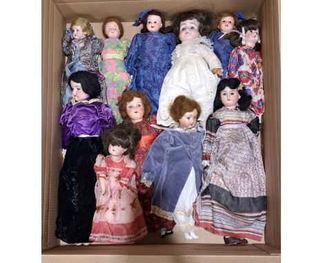 Quantity of vintage bisque dolls; some damage throughout, most with repair/replacement bodies/new shoulders (all heads origin