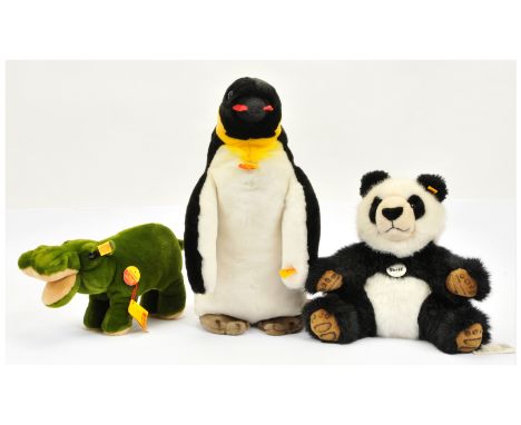 Steiff trio of plush animals, including Charly penguin, yellow tag 2510/40, Cosy Hippo, yellow tag 5510/30, and Manschli pand