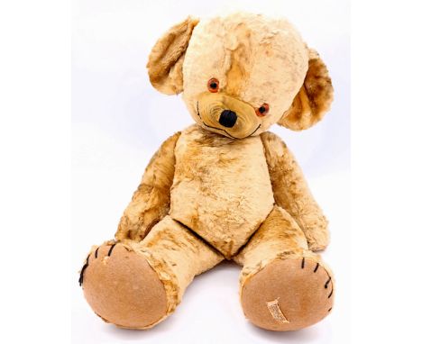 Merrythought Cheeky vintage teddy bear, British, late 1950s to early 1960s, golden silk plush, white Regd Design label to lef