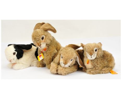 Steiff group of plush rabbits, including Spotty, yellow tag 2985/30, and 3x Dormy: yellow tags 2978/35, 2975/25, and 2972/40;