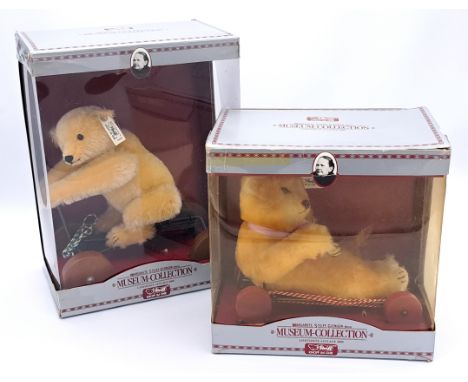 Steiff teddy bear pair including: (1) Museum Collection Record Teddy 1913 Replica, blonde mohair teddy bear on a bike, 1990, 