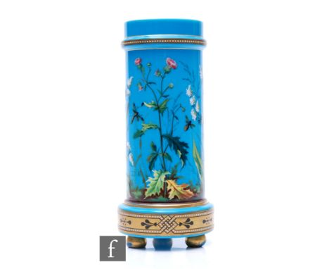 A 19th Century French blue opal glass vase of footed cylindrical form, hand enamelled with flowers and foliage with insects b