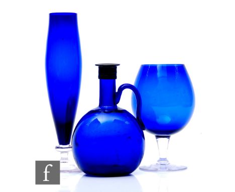 A 19th Century Bristol blue flagon, circa 1850, of compressed globe form with applied handle, 20cm, together with a 1960s gla