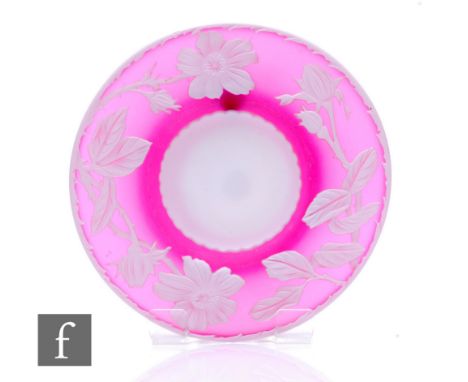 A late 19th Century Stevens &amp; Williams cameo glass plate of shallow circular form with wide rim, cased in opal over ruby 