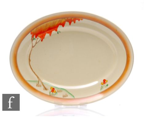 A Clarice Cliff oval meat plate circa 1940, hand painted in a shoulder variant of the Taormina pattern with a stylised tree l