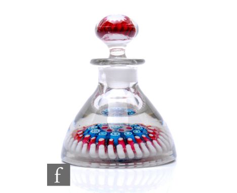 An Old English glass inkwell of domed form, internally decorated to the base with a central millefiori cane in green and whit