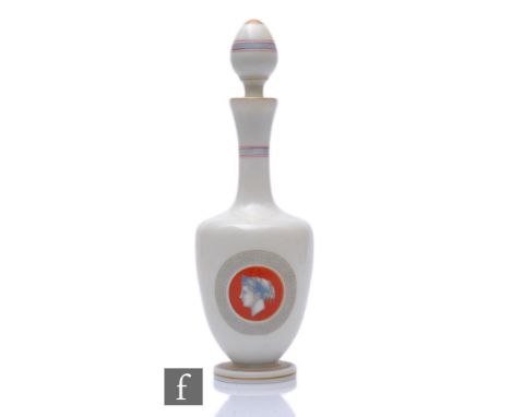 A late 19th Century French opaline glass decanter of shouldered ovoid form with tall slender collar neck and spire form stopp