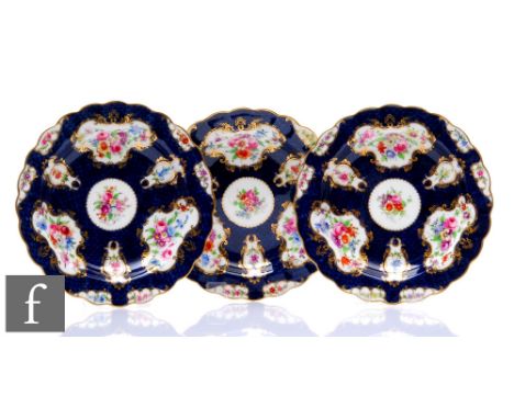 Three early 20th Century Royal Worcester cabinet plates decorated by Phillips, with hand painted floral sprays in shaped cart