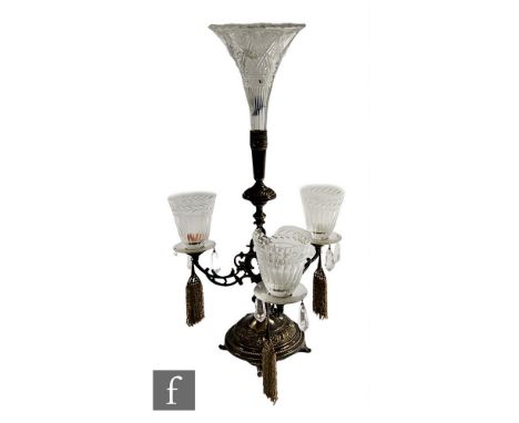 A Edwardian plated three branch epergne, the central flute above three sconced goblets, drop lustres and beaded tassels on a 