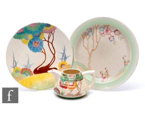 A Clarice Cliff Lydiat shape teapot, lacking cover, circa 1935, hand painted in the Aurea pattern with a stylised tree landsc