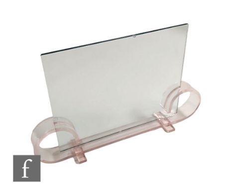 A 1930s Art Deco picture frame, the pale pink acrylic base with scroll ends fitted with two sheets of plain glass.