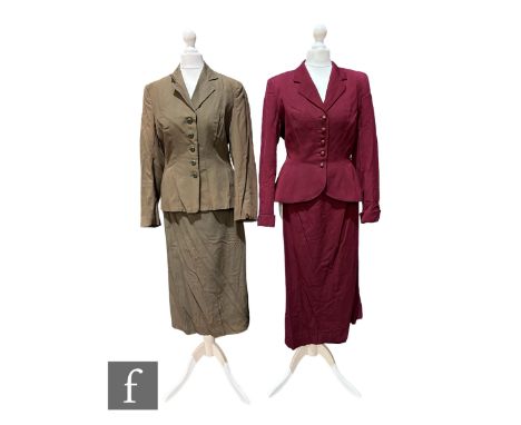 A 1940s/50s vintage two piece suit in maroon, the fitted jacket with button fastening and A line skirt, bears Dellbury London