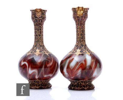 A near pair of late 19th Century Loetz Onyx vases, each of footed globe and shaft form with tall collar necks and frill rim, 