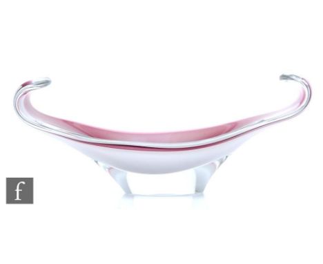 A post war Flygsfors Coquille dish by Paul Kedelv circa 1962, of elliptical form with scrolled ends cased in clear crystal ov