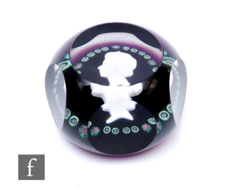 A late 20th Century Baccarat glass paperweight, in the Jubilee pattern, internally decorated with a large sulphide side profi