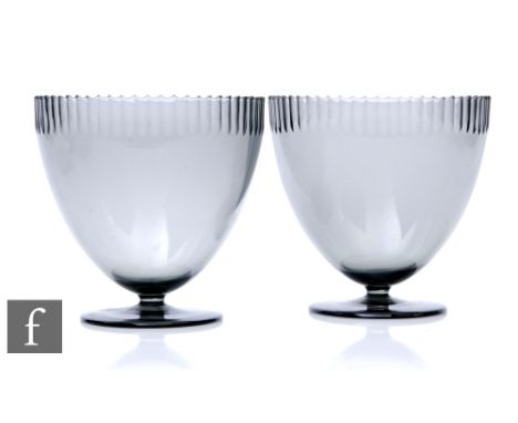 A pair of 1930s Orrefors pedestal bowls designed by Simon Gate, each of ovoid form with a hand cut scalloped rim over the smo