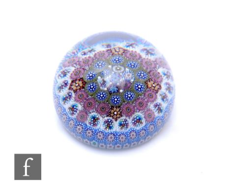 A contemporary Twists Glass paperweight, designed by Mike and Aaron Hunter, internally decorated with concentric circles of m