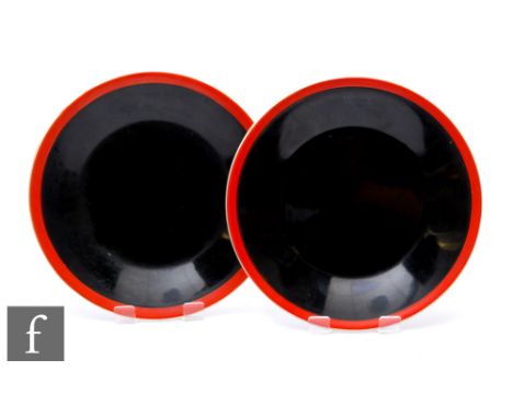 A pair of Clarice Cliff Yoo-Hoo side plates circa 1930, each with a red enamel band over black glazed body, partial Bizarre m