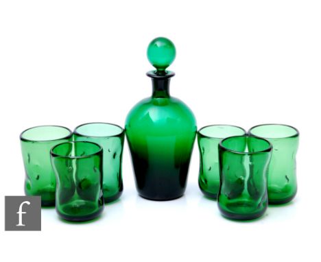A set of six mid 20th Century Blenko glass tumblers of hand blown dimpled form in deep green, together with a green decanter 
