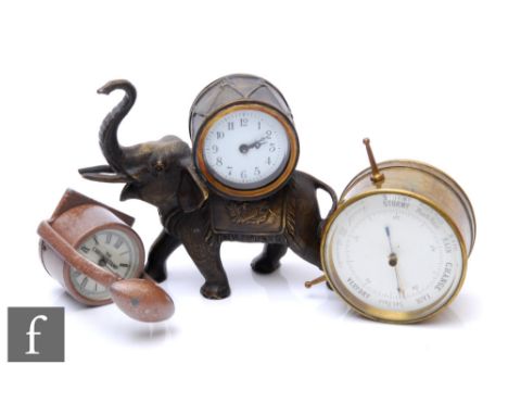 A small early 20th Century bronzed clock in the form of a trumpeting elephant, the movement housed in a drum with a small bra