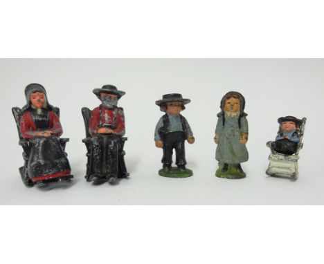 Five small vintage painted lead figures modelled as American Amish figures (three in rocking chairs).