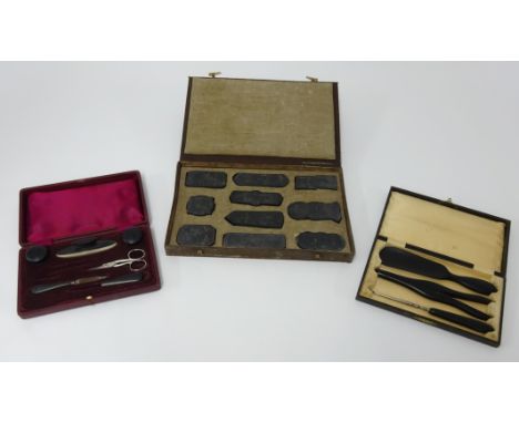 Set of printing blocks, and two vintage travel sets, manicure and gloves, all cased (3).