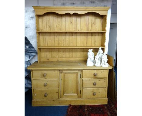 A 19th century pine dresser, with a later top shelf unit, width 168cm.