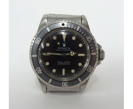 Rolex, a 1969/1970 gents stainless steel Submariner, model 5513, the dial with 'metres first', with original box, Rolex bookl