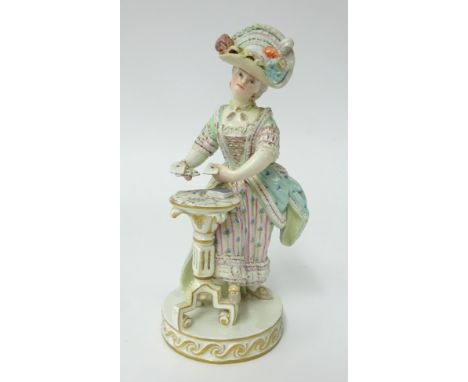 A late 19th century Meissen porcelain figure of a standing woman in 19th century costume by a tripod table playing cards, 'Th