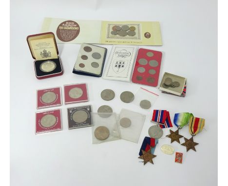 Three WWII medals R. Richardson, Yorkshire, boxed, together with a small mixed lot of commemorative proof crowns etc.