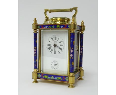 A large brass enamelled carriage clock with alarm and repeat, of Chinese style, height 20cm, handle up.