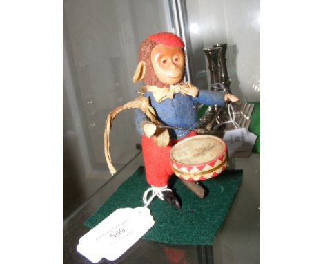 A Schuco wind up tin plate monkey from the 1930's - 11cm tall CONDITION REPORT In our judgement, lot is not in full working o