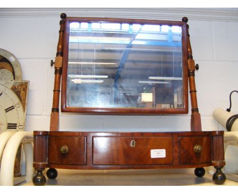 An antique mahogany toilet mirror 