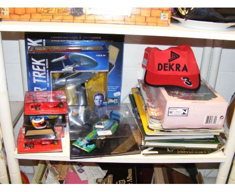 A sundry lot containing Star Trek Classic Phaser, Communicator and Tricorder, die cast model race cars, Ballet Barbie doll an
