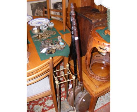 Two copper bedpans, brass umbrella and stick stand, horse brasses and other metalware 