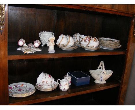 Two shelves of collectable ceramic ware including Royal Worcester candle snuffer