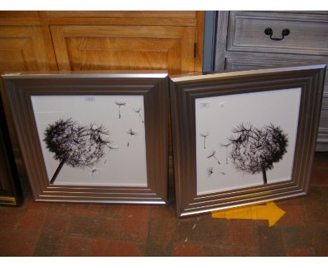 A pair of contemporary dandelion clock prints with relief work to glazing 