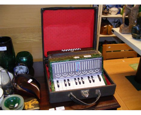 A vintage USSR accordion in case 