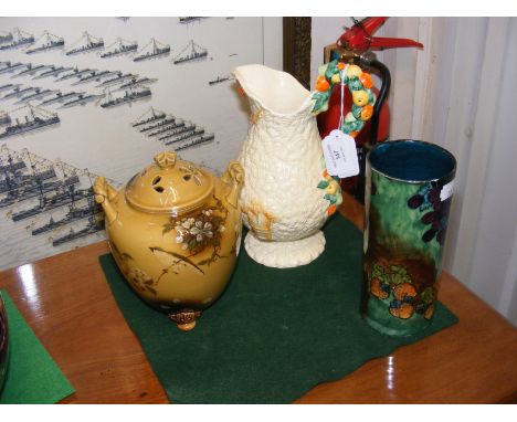 A Clarice Cliff Harvest jug, together with two other pieces of ceramic ware