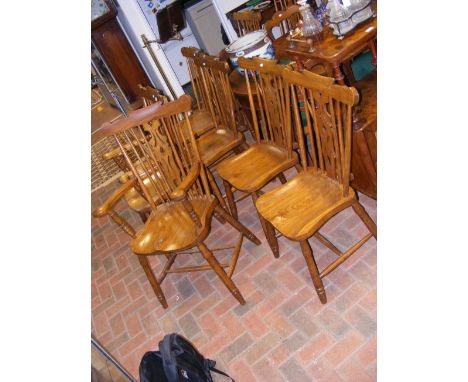 A set of eight Isle of Wight made country stick back dining chairs including 'His and Her' carvers, monogrammed 'PW' to base