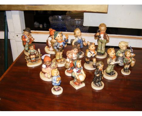 A selection of collectable Hummel figures including 'Boots'