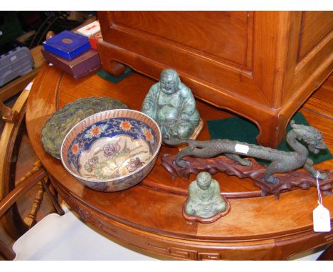 An oriental ceramic bowl, together with metal figurines, including laughing Buddha and dragon 
