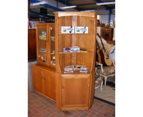 An Ercol Golden Dawn corner cabinet