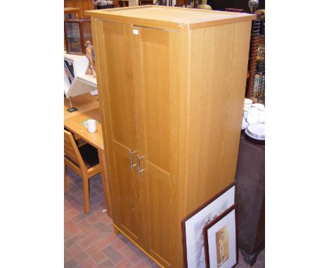 A contemporary light oak two door wardrobe - width 85cm 