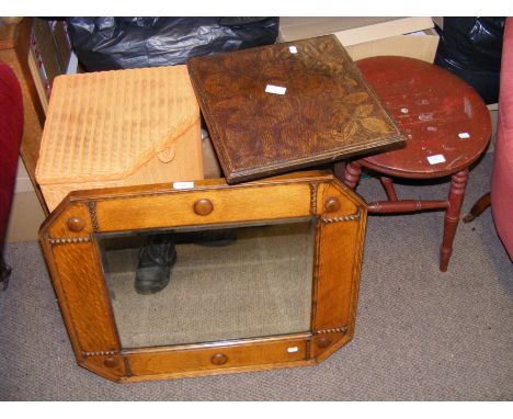 A Lloyd Loom corner linen basket, together with two occasional tables and an oak framed bevelled wall mirror etc.