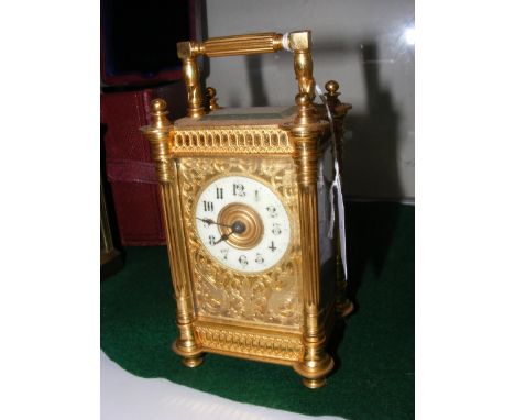 A decorative antique French carriage clock - 16cm high
